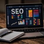 Best laptops for blogging and SEO work showing a modern laptop with SEO analytics dashboard
